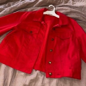 Size 12W cropped red jacket by woman within